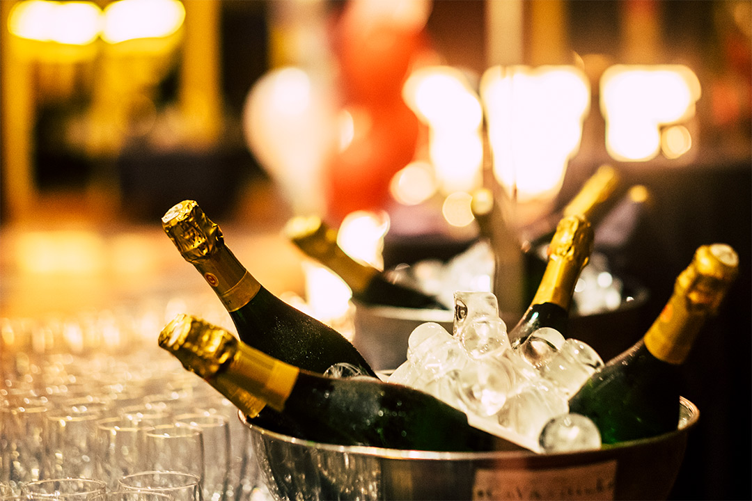 Champagne bottles chilled in silver ice buckets for VIP service